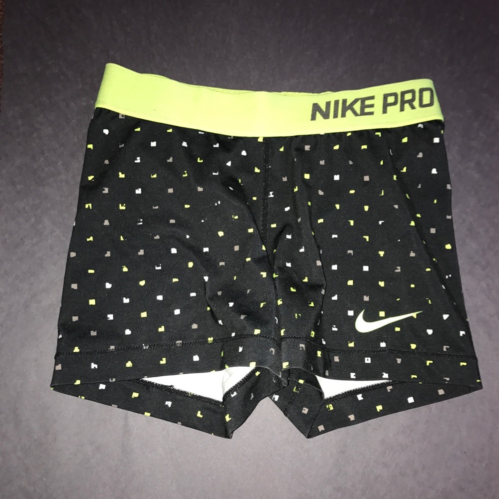 adult small black nike pros with neon design